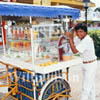 GW01110-32 = Street fruit juice seller, Cancun Town, Yucatan, Mexico.