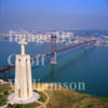 GW02980-32 = Aerial view of 100m high Statue of Christ the King looking towards Ponte 25 de Abril (1966 built bridge), River Targus and Belem district of Lisbon, Portugal.