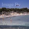 GW22395-50 = View over Tora beach with young kite flyer in foreground, Paguera, Calvia, SW Mallorca, Balearic Islands, Spain. 