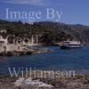 GW22530-50 = Scene at Camp de Mar ( view over bay with restaurant island, visiting tourist boat, and hillside villa complex recently owned (July 2005) by Claudia Schiffer ), SW Mallorca, Balearic Islands, Spain.