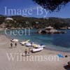 GW22550-50 = Scene at Camp de Mar ( view over beach and bay with pedalos, restaurant island, and hillside villas ( including villa complex recently owned (July 2005) by Claudia Schiffer )), SW Mallorca, Balearic Islands, Spain. 