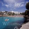 GW22615-50 = View over Cala Gran ( sea inlet + beach + monster pedalo ) towards villas and hotel Cala Gran, Cala Dor resort, SE Mallorca, Balearic Islands, Spain.