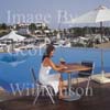 GW30185-60 = Scene at Cala D'Or Yacht Club - poolside drink - overlooking Marina of Cala D'Or, Cala D'Or, Ajuntamiento de Santanyi, South East Mallorca, Balearic Islands, Spain. 11th September 2007. Model Release.