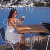 GW30200-60 = Scene at Cala D'Or Yacht Club - poolside drink - overlooking Marina of Cala D'Or, Cala D'Or, Ajuntamiento de Santanyi, South East Mallorca, Balearic Islands, Spain. 11th September 2007. Model Release.