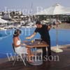 GW30210-60 = Scene at Cala D'Or Yacht Club - delicious poolside snack - overlooking Marina of Cala D'Or, Cala D'Or, Ajuntamiento de Santanyi, South East Mallorca, Balearic Islands, Spain. 11th September 2007. Model Release.