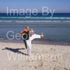 GW31855-60 = Professional Tai Chi and Kong Fu Instructor working out on a beach in Mallorca, Spain.