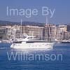 GW32325-60 = Boat Show Bound - Sanlorenzo SL98 motor yacht ( with Paseo Maritimo in the background ) heading for Palma International Boat Show 2008 in Old Port ( Moll Vell / Muelle Viejo ) Area of the Port of Palma de Mallorca, Balearic Islands, Spain. 24th April 2008.