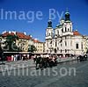 GW01700 = Church of St. Nicholas in the old town with carriage. Prague, Czech Repulic. Aug 1995.